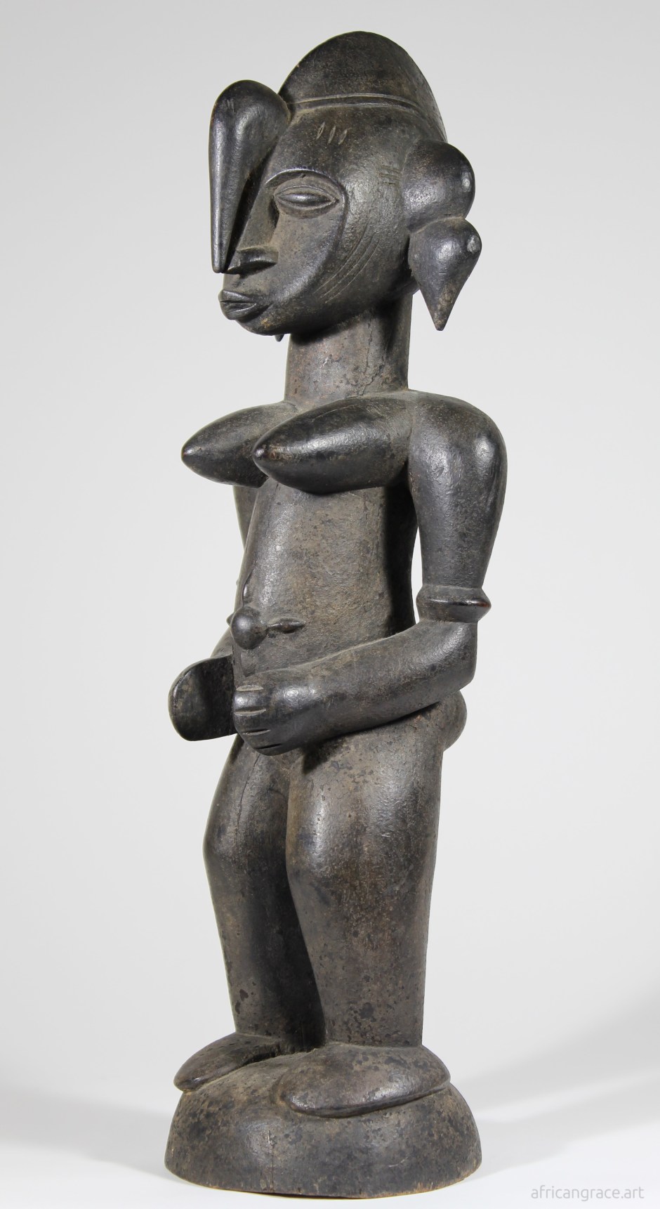 Senufo tugubele female figure left front view